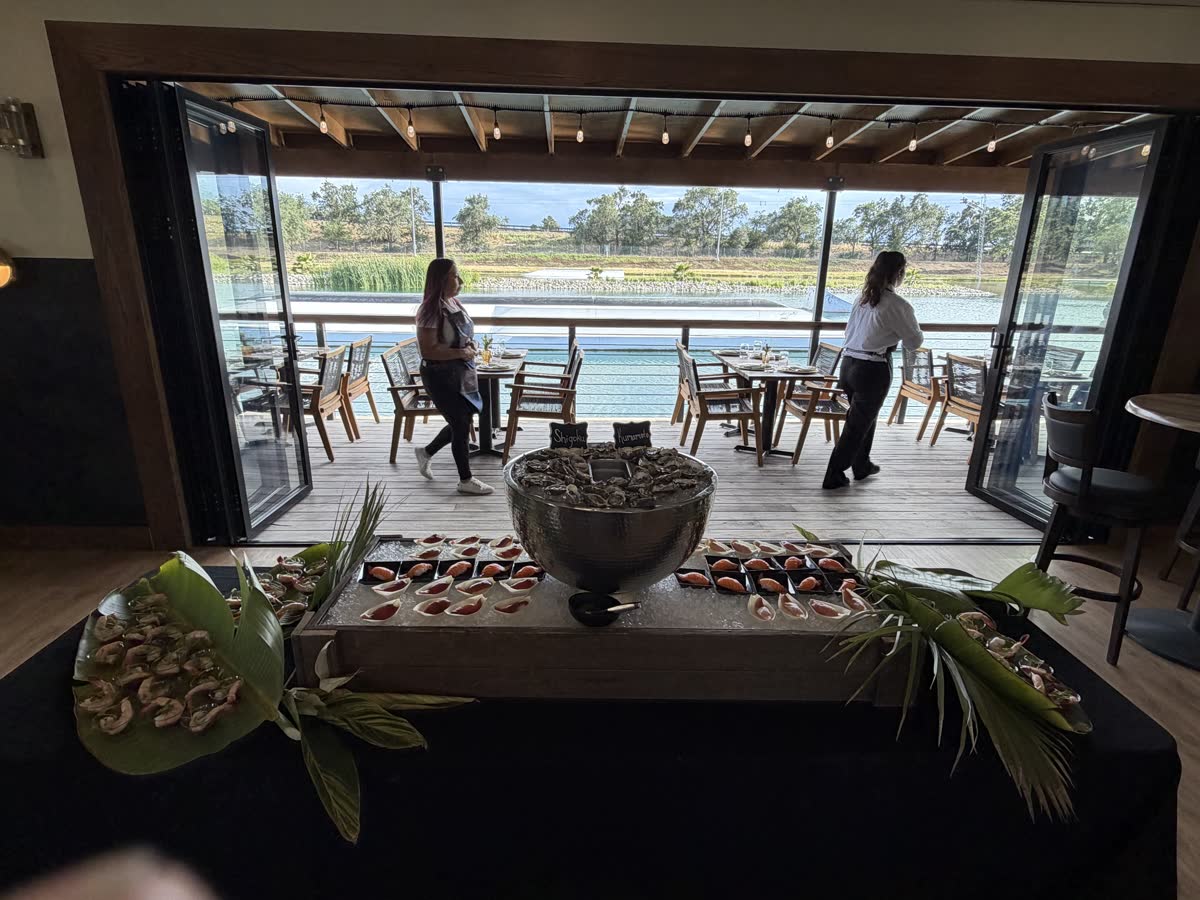 Seafood catering spread with the glass walls open to the deck